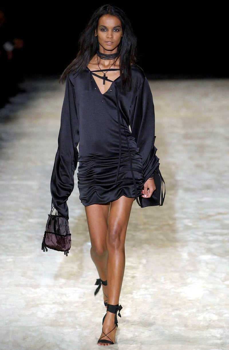 Black lace bondage silk dress on runway model, Fall 2002 Gucci collection