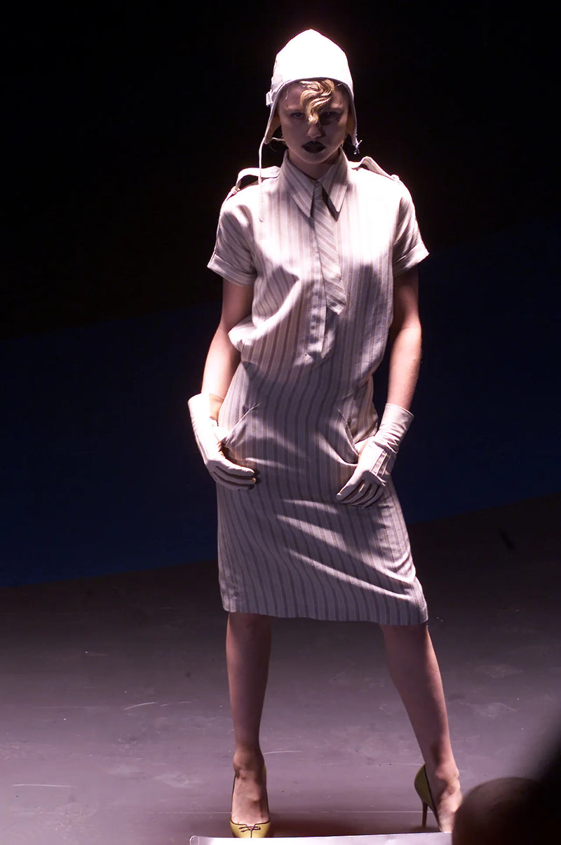 Runway look from Alexander McQueen F/W 2001 collection featuring military shirt dress silhouette