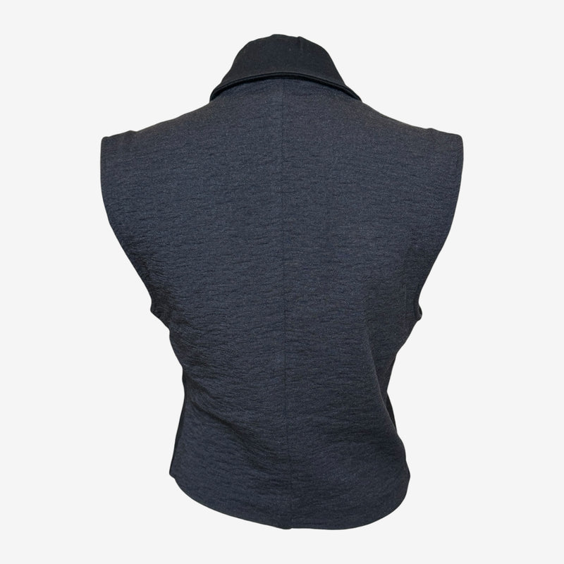 Close-up of Helmut Lang vest buttons, ornate gold-tone shell and dome button details