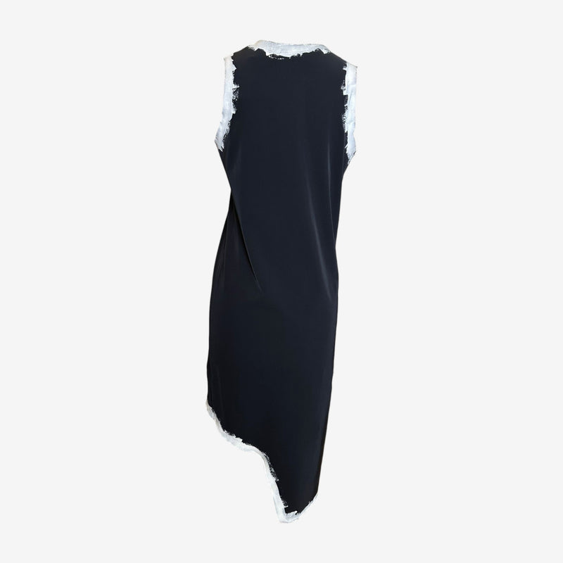 Side profile of sleeveless black jersey dress by Comme des Garçons, S/S 1992 collection
