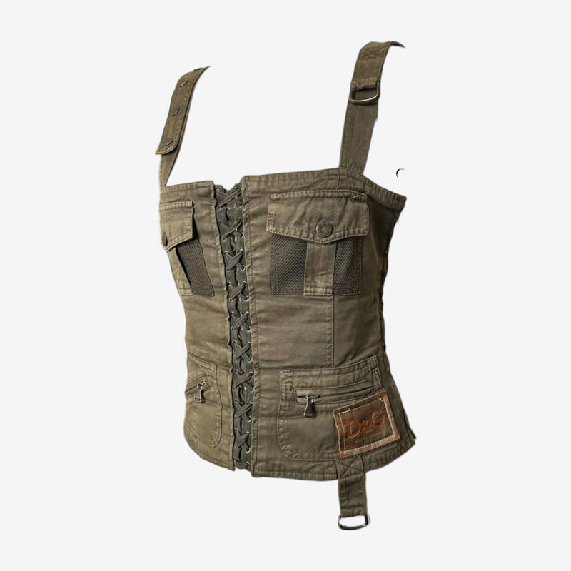 Detail of black leather lace-up corset closure on Dolce & Gabbana military canvas bustier