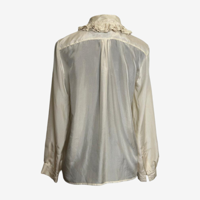 Detailed view of ruffled front placket and concealed button fastening on Chloé silk blouse