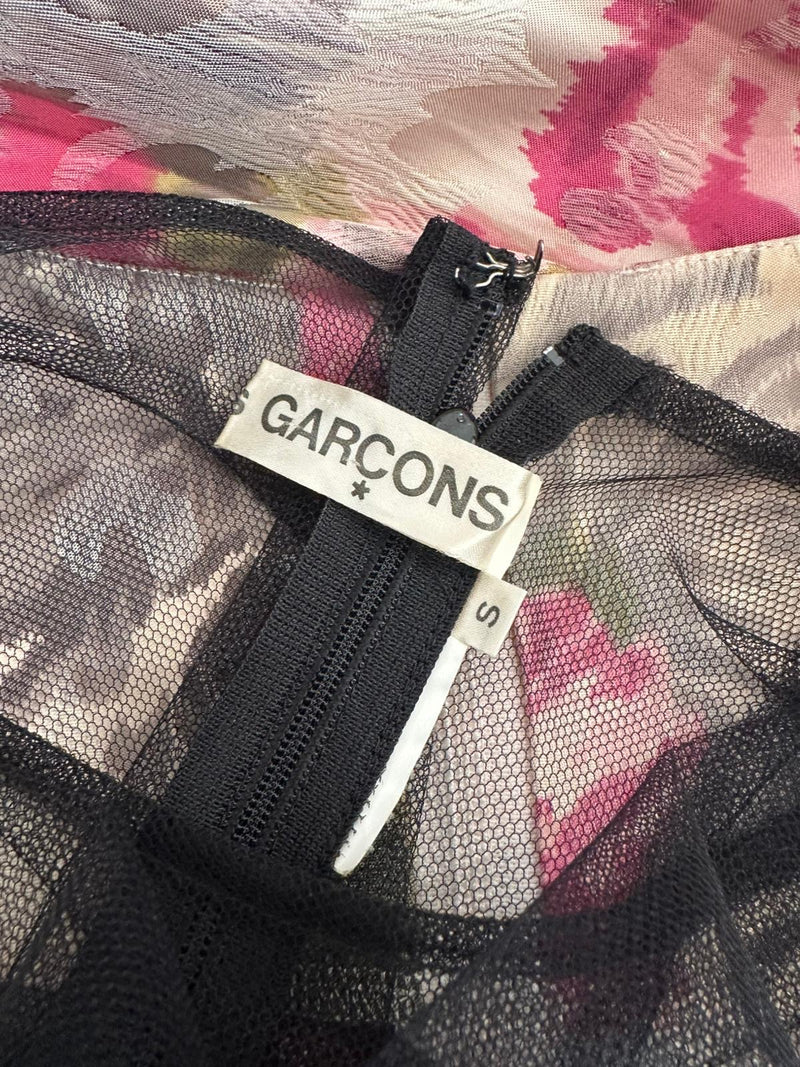 Black mesh overlay detail on Comme des Garçons floral print dress, geometric panel construction