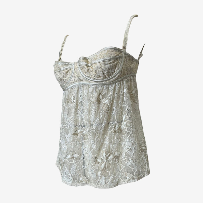 White lace bustier top by Dolce & Gabbana, side view showing fitted silhouette and side boning