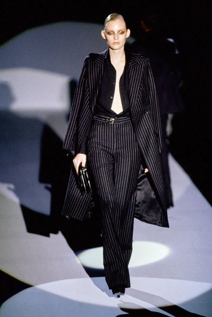 Navy pinstripe wool jacket by Gucci, notched lapels with golden button closure