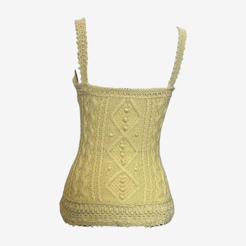 Detail of Louis Vuitton cable knit tank top showing decorative button embellishments integrated into cable work