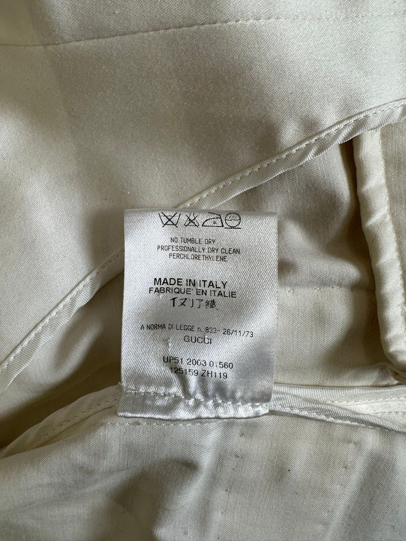 White cotton military jacket by Gucci, full length view showing structured silhouette