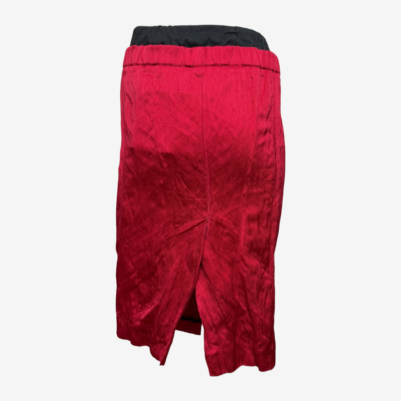 Red crinkled midi skirt by Prada, side profile showing pencil silhouette
