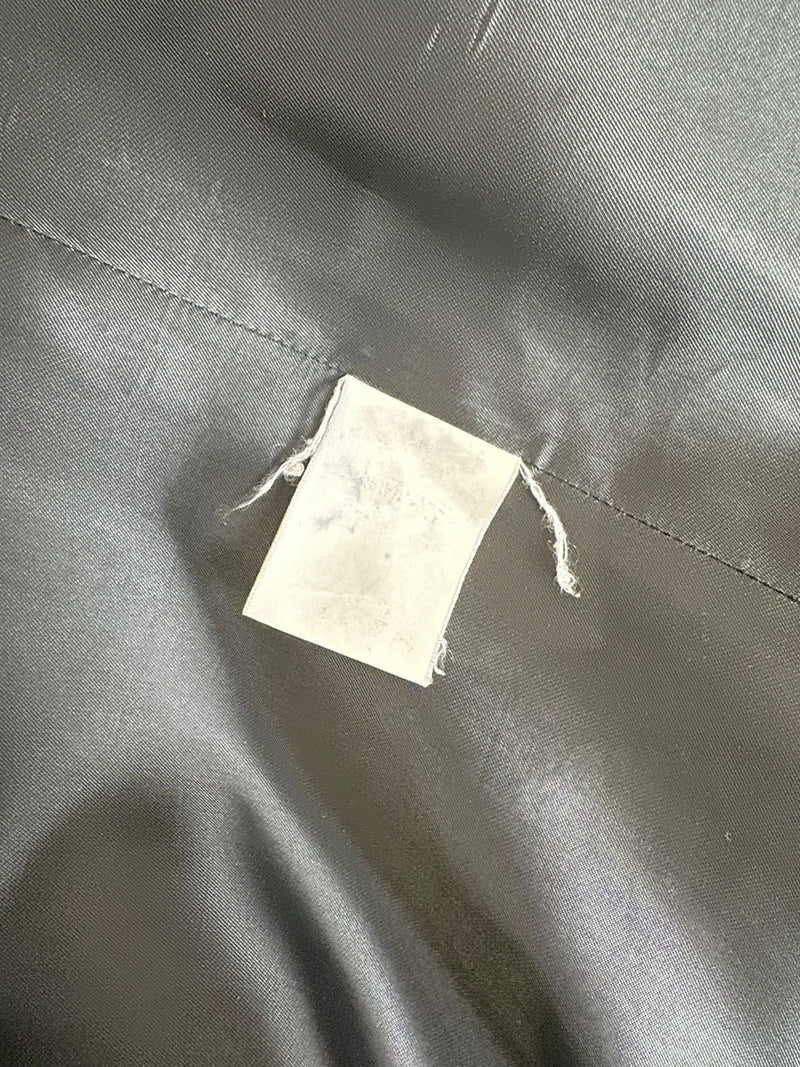 Original YSL label and interior construction detail on navy double-breasted military coat