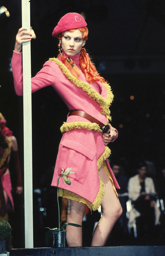 Gold-toned domed button with mother-of-pearl inlay detail on Dior tweed jacket