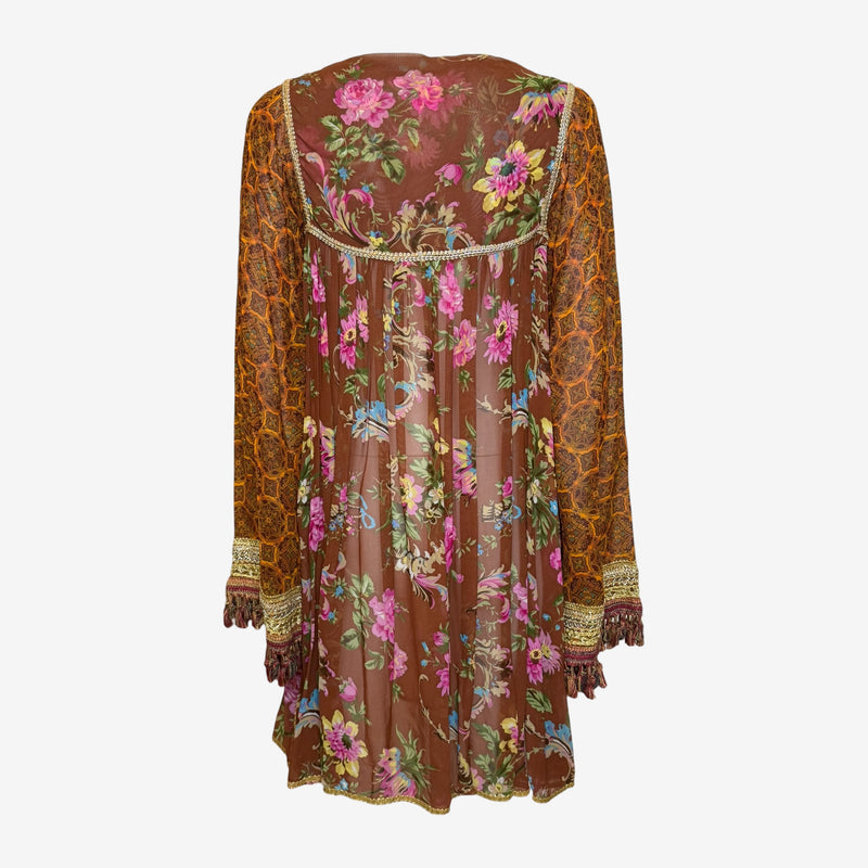 Detail of braided metallic trim and tassel fringe on Dolce & Gabbana empire waistline