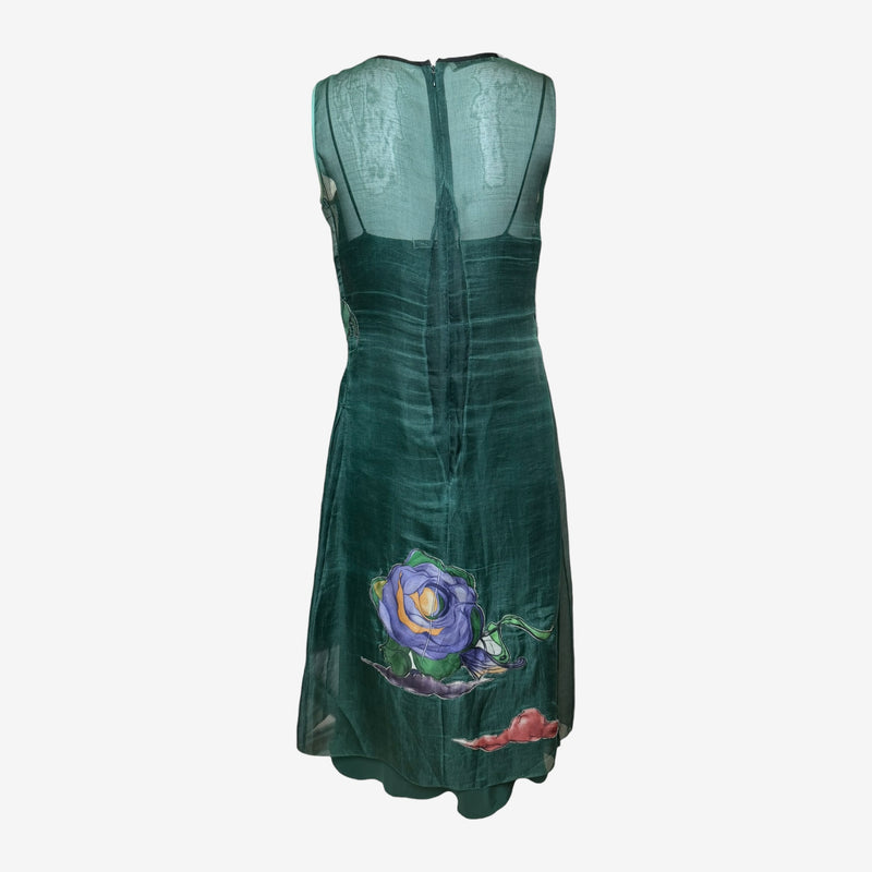 Emerald green silk organza dress by Prada, back view showing invisible zip and fairy print placement