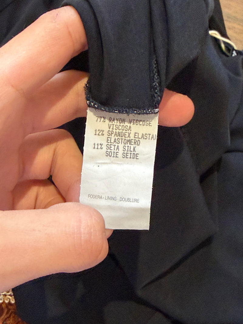 Black keyhole top by Gucci, close-up of hook closure mechanism