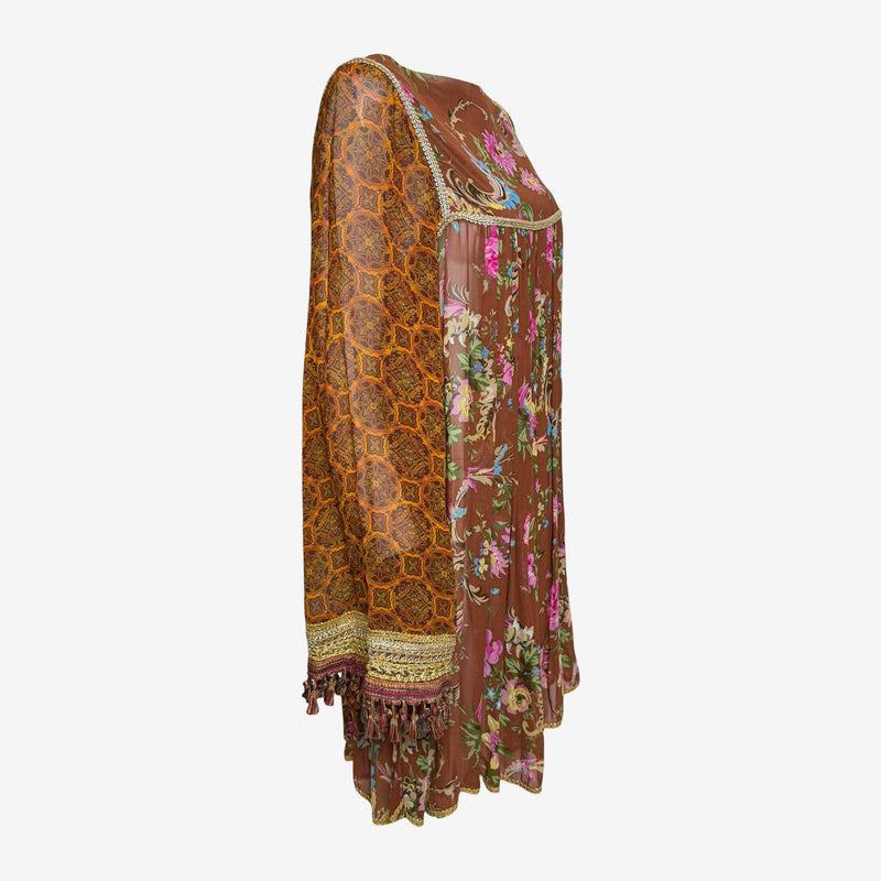Side detail of Dolce & Gabbana silk dress with paisley sleeve pattern and tassel fringe cuff