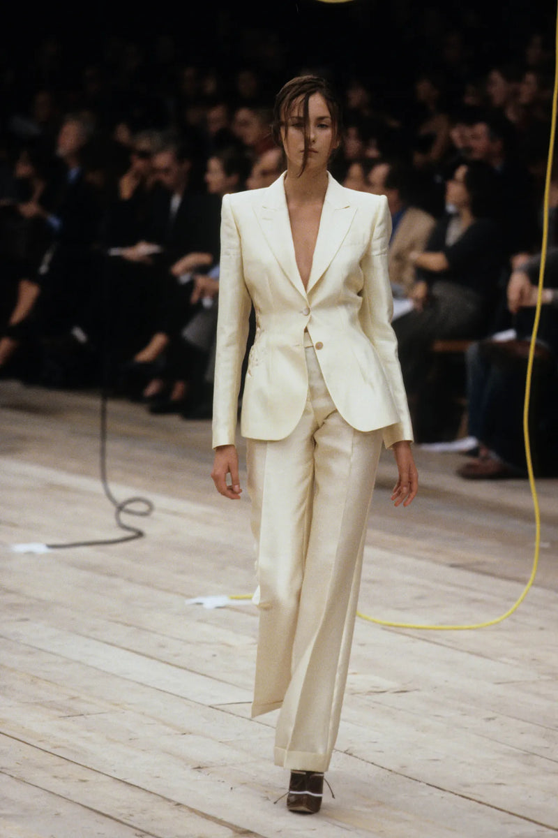 Alexander McQueen S/S 1999 runway look featuring iridescent grey wool suit with straight-leg trousers
