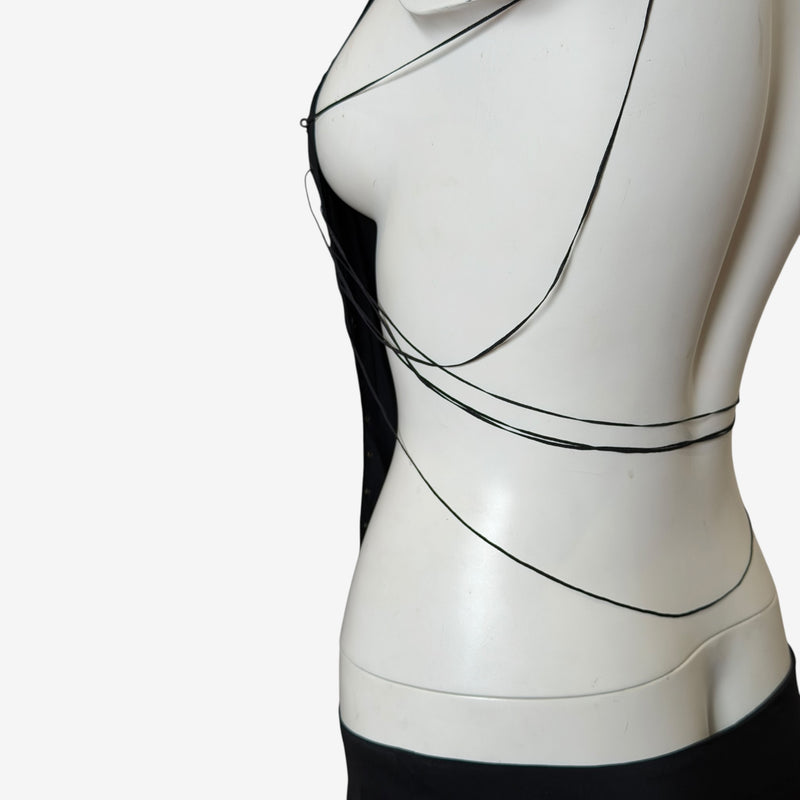 Detail of gunmetal eyelet construction with black silk cord threading