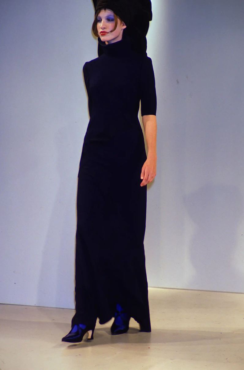 Black evening gown by John Galliano, front view showing high neck and bias-cut silhouette