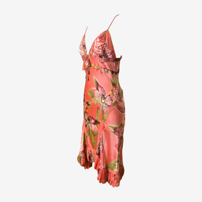 Roberto Cavalli silk dress showing asymmetrical ruffle hem detail and bias-cut midi skirt in botanical print