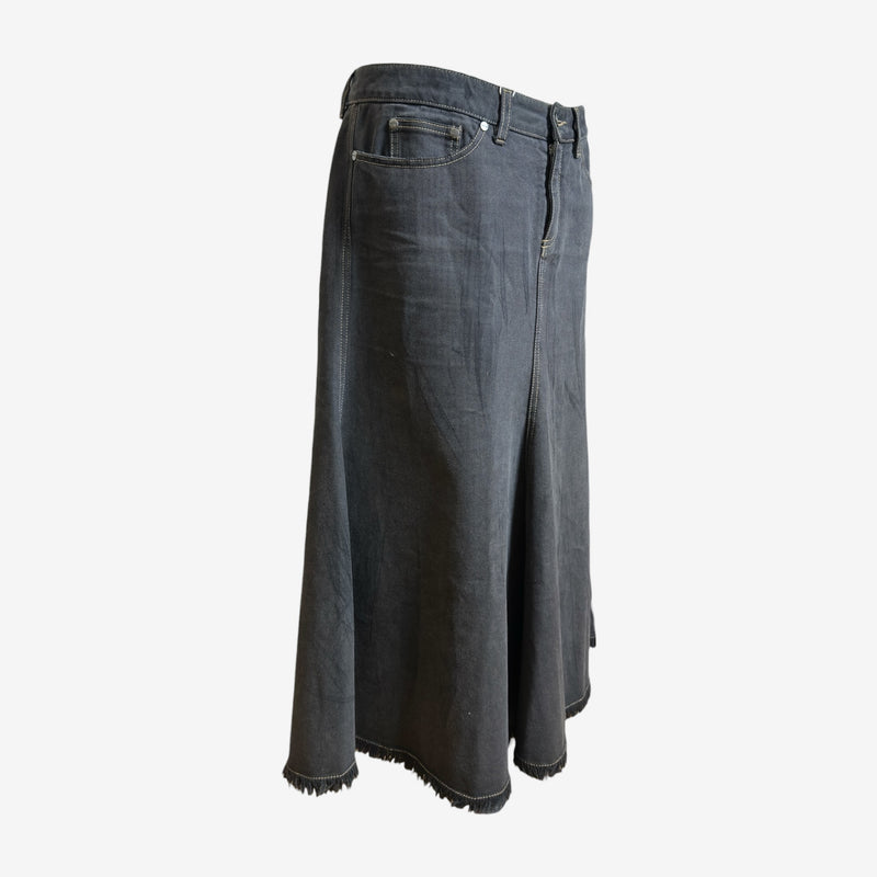 Alexander McQueen deconstructed denim maxi skirt, side view showing raw-edge frayed hemline