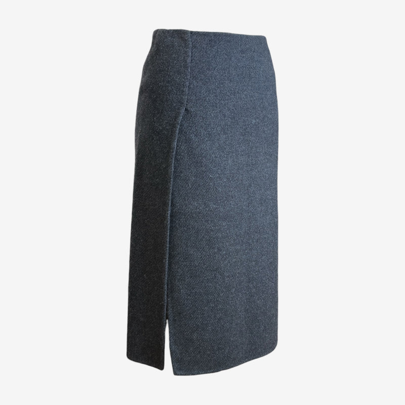 Charcoal grey wool pencil skirt by Prada, side view displaying mid-thigh slit detail