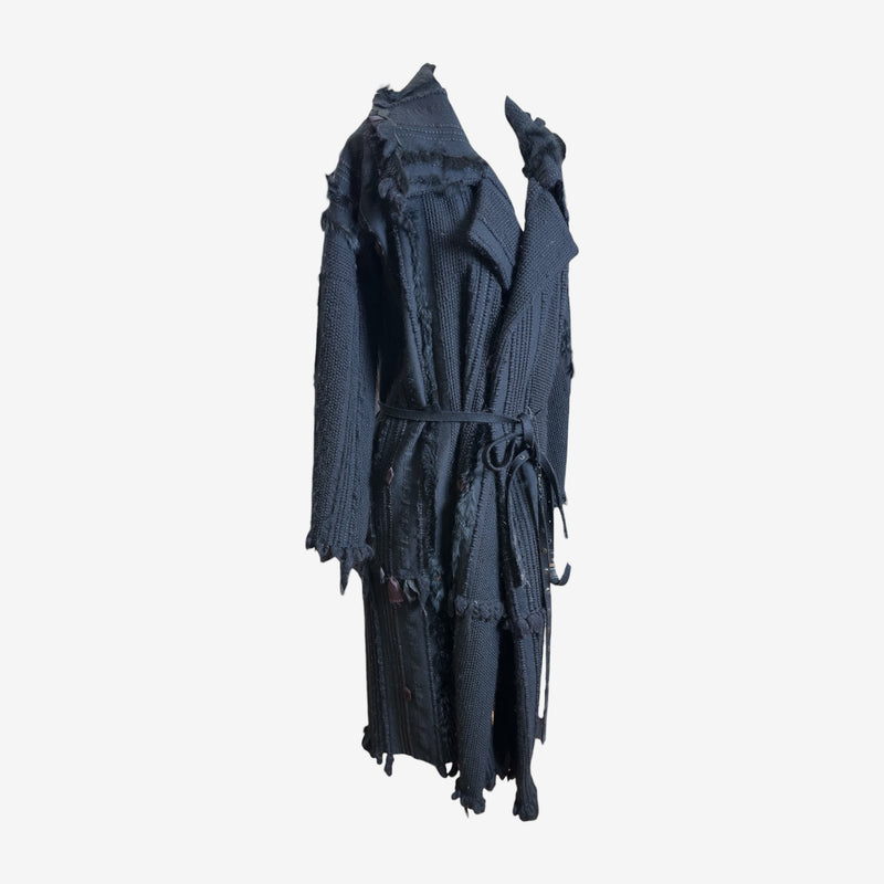 Charcoal grey cotton knit coat by Gucci Tom Ford, side profile showing asymmetrical hemline and raw edge detailing