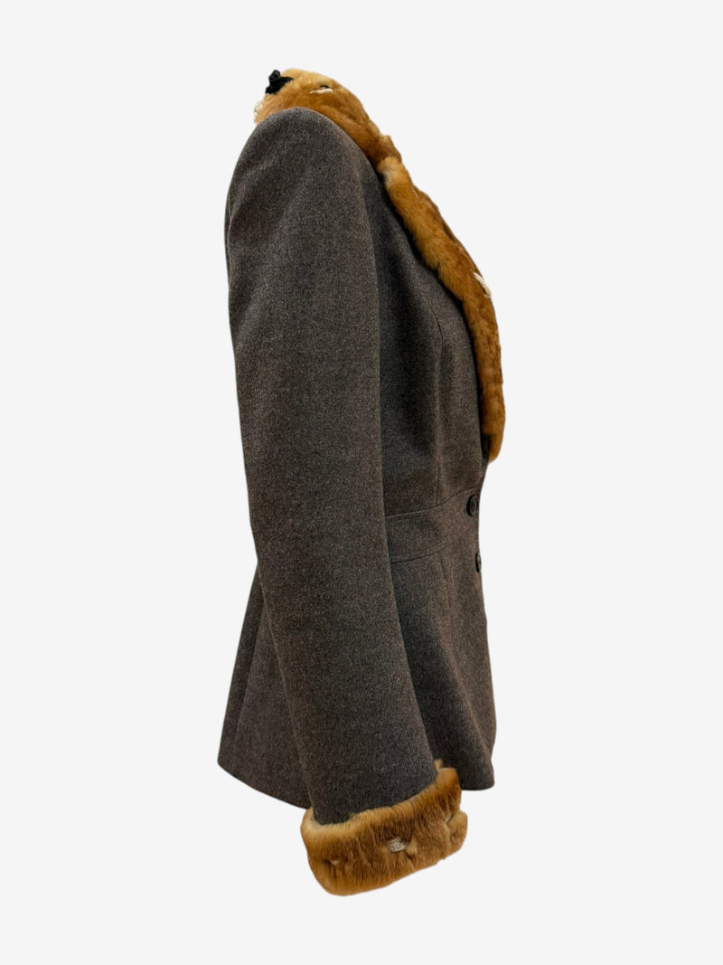 Detail of plush amber rabbit fur collar with ivory leather and black ribbon inserts on John Galliano blazer