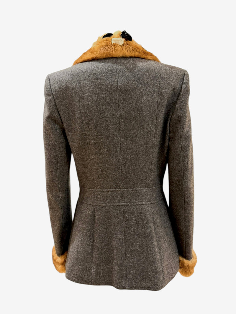 Rear view of John Galliano wool blazer showing nipped waist and self-fabric belt detail