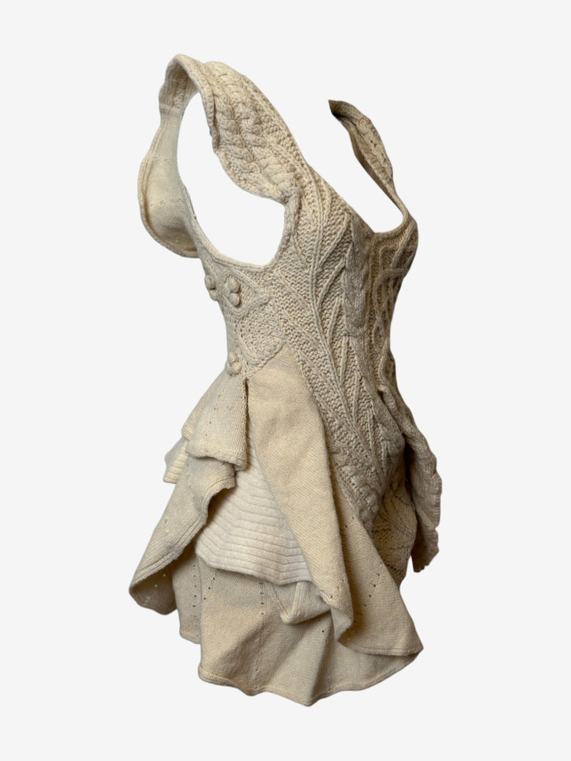 Cream cable knit asymmetric dress by Tao Comme des Garçons, side view of draped skirt with geometric ribbed sections
