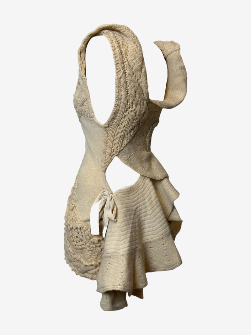 Cream cable knit dress by Tao Comme des Garçons, back view showing asymmetric draped construction