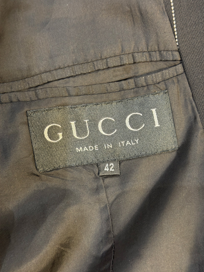 Navy pinstripe wool trousers by Gucci, flat front construction with bootcut hem