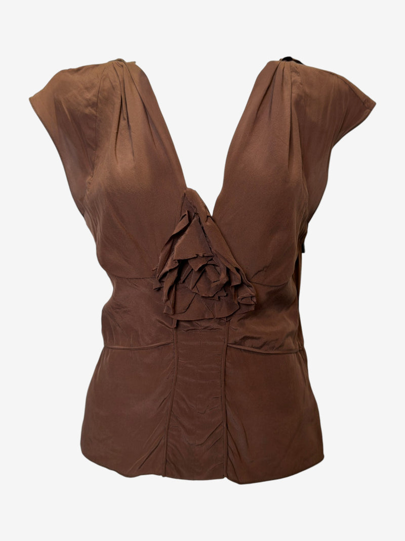Detail of brown silk skirt cascading ruffles along side seam, asymmetrical construction