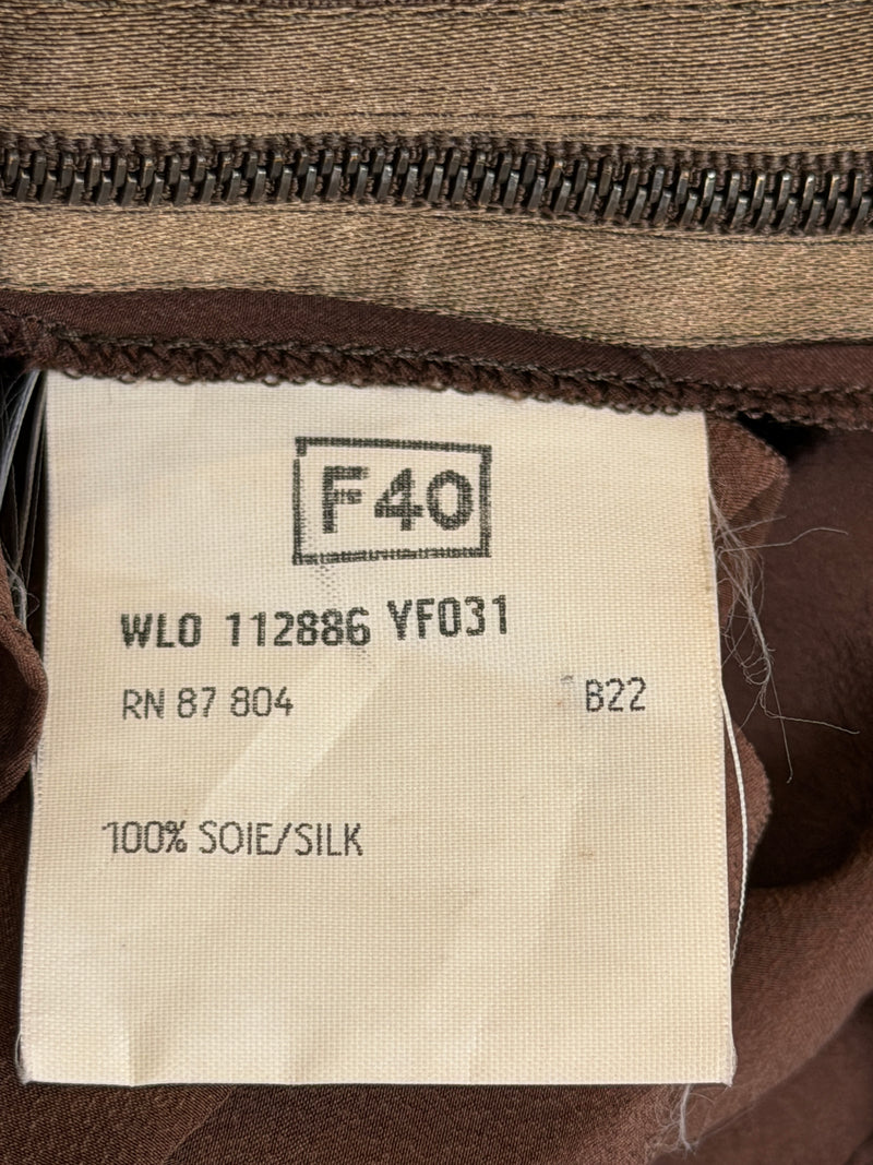 Close-up of skirt ruffles and hemline construction detail, brown silk