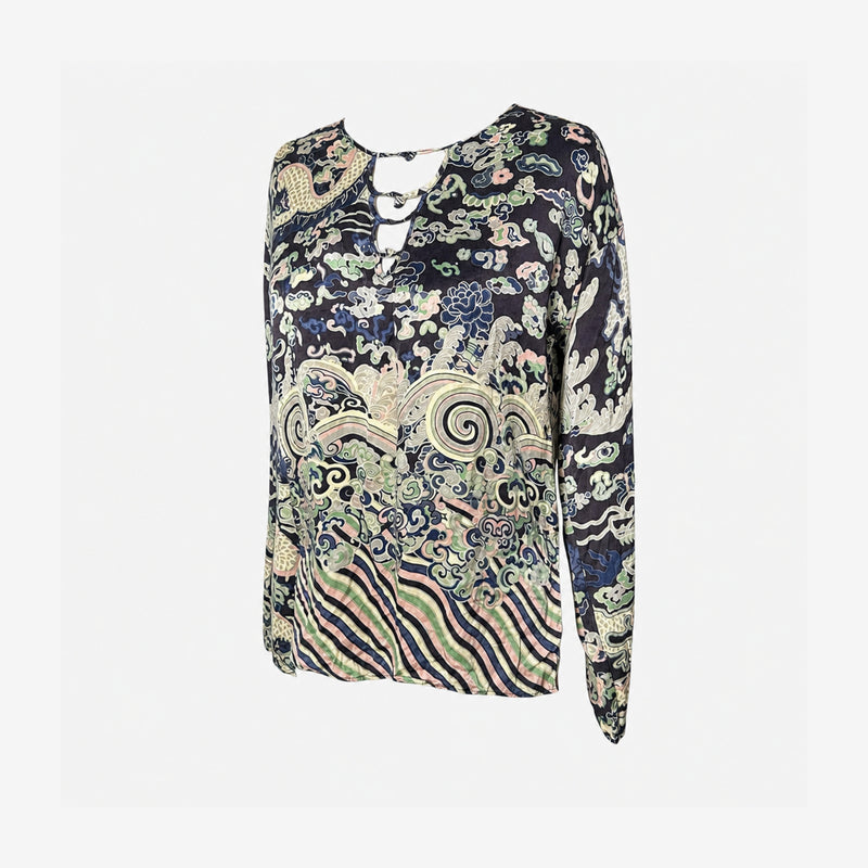 Side detail of Tom Ford era YSL blouse, fitted cuff and dragon print pattern flow