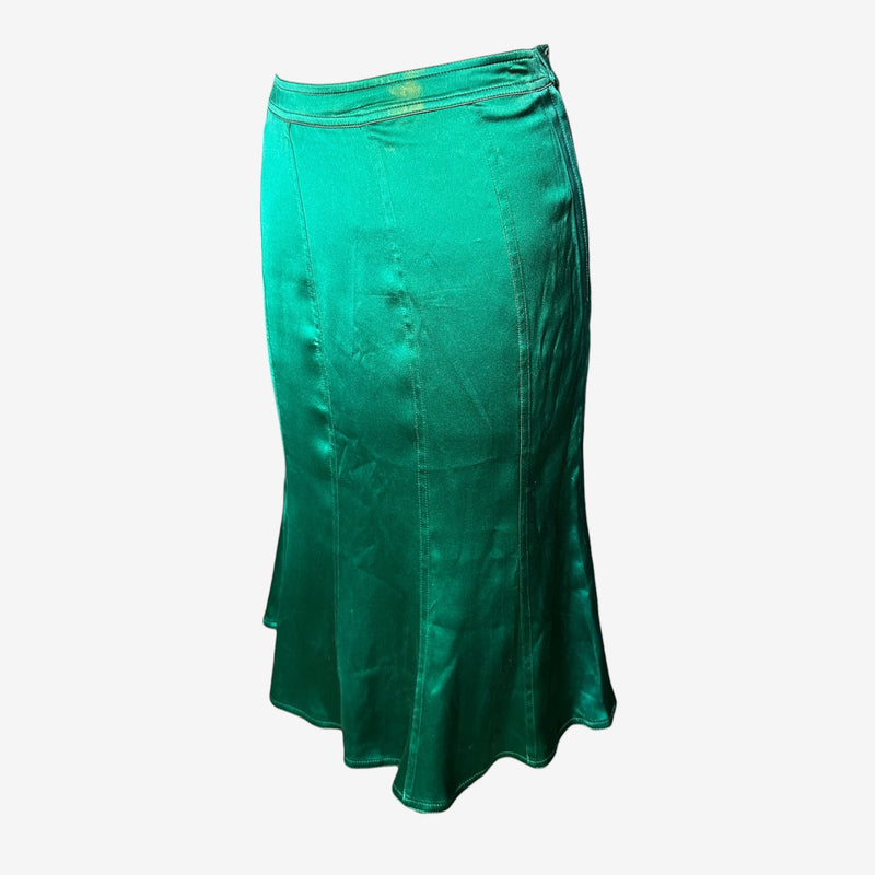 Back view of emerald green YSL skirt, flared mermaid silhouette with side zip closure