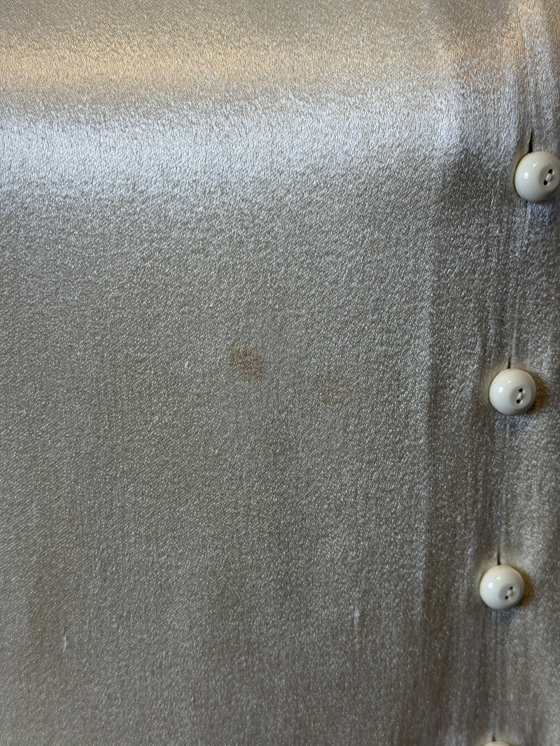 Wide-leg trouser detail by Yves Saint Laurent, high-waisted satin construction