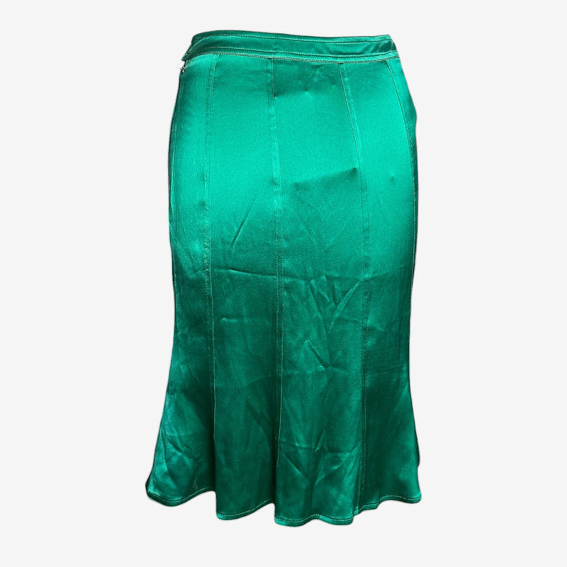 Detail of emerald silk satin fabric with vertical seaming structure on fitted YSL skirt