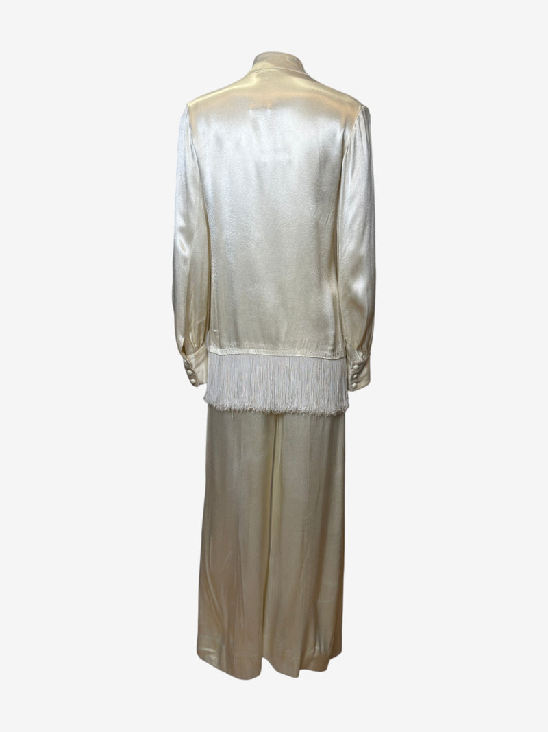 Balloon sleeve detail on silver satin blouse by Yves Saint Laurent, pearl button cuff