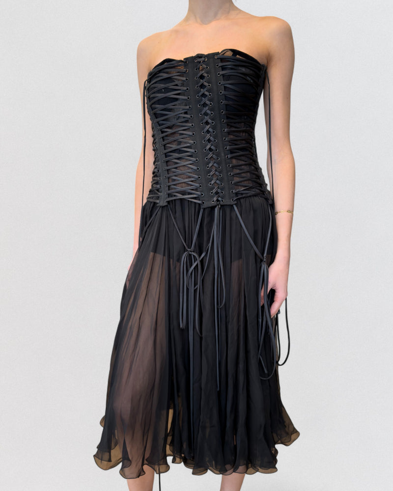 Black corset dress by Dolce & Gabbana with semi-sheer chiffon skirt and structured lacing