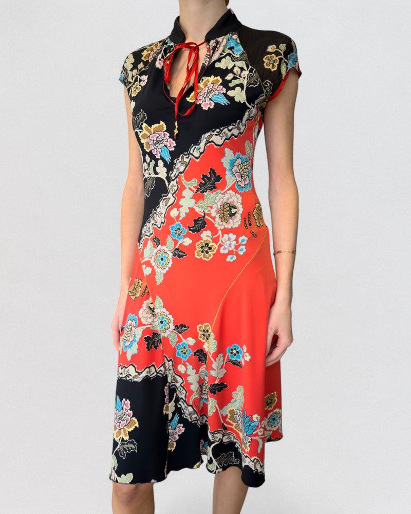 Side view of Roberto Cavalli cheongsam dress showing asymmetrical cut and red ribbon keyhole neckline