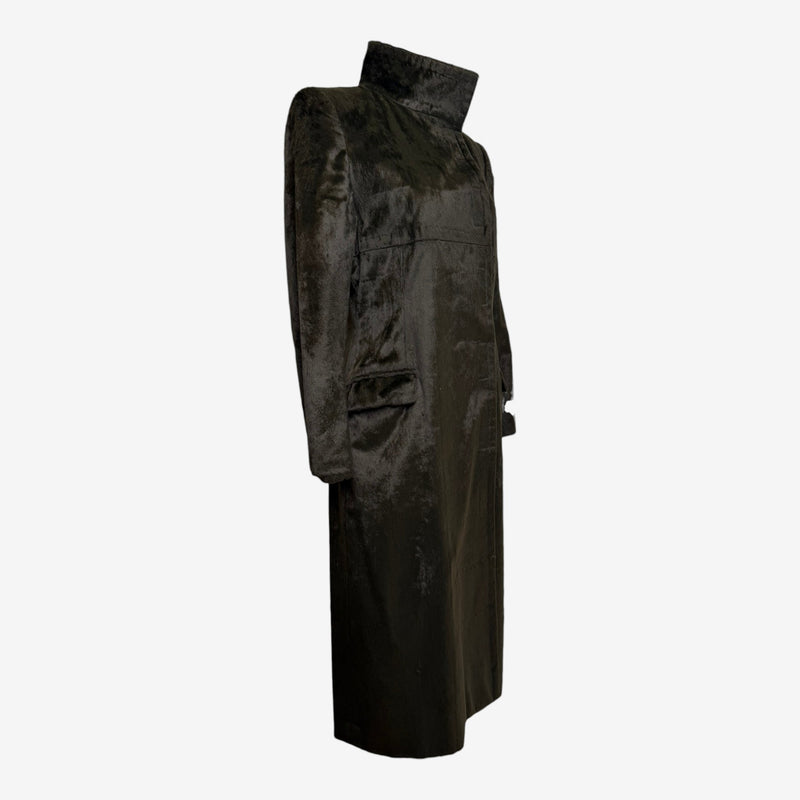 Olive green faux fur coat by Chloé, side profile showing tailored silhouette and sleeve structure