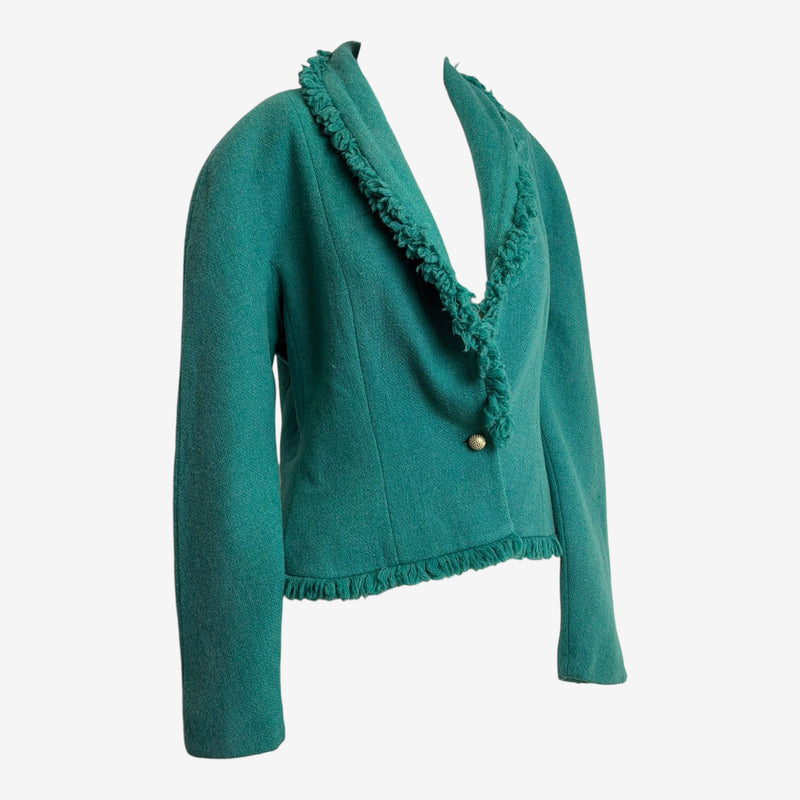 Emerald green Donegal tweed jacket by Christian Dior, side profile showing fringe trim and cropped silhouette