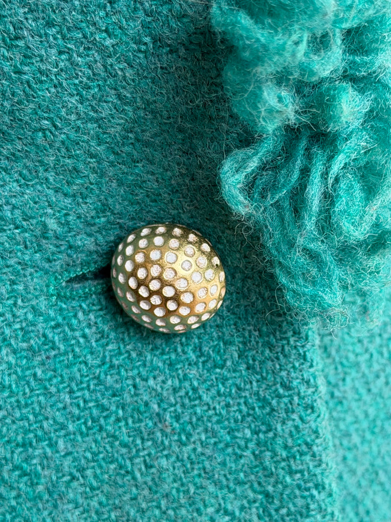 Green silk lining with embroidered CD logo inside Dior tweed jacket