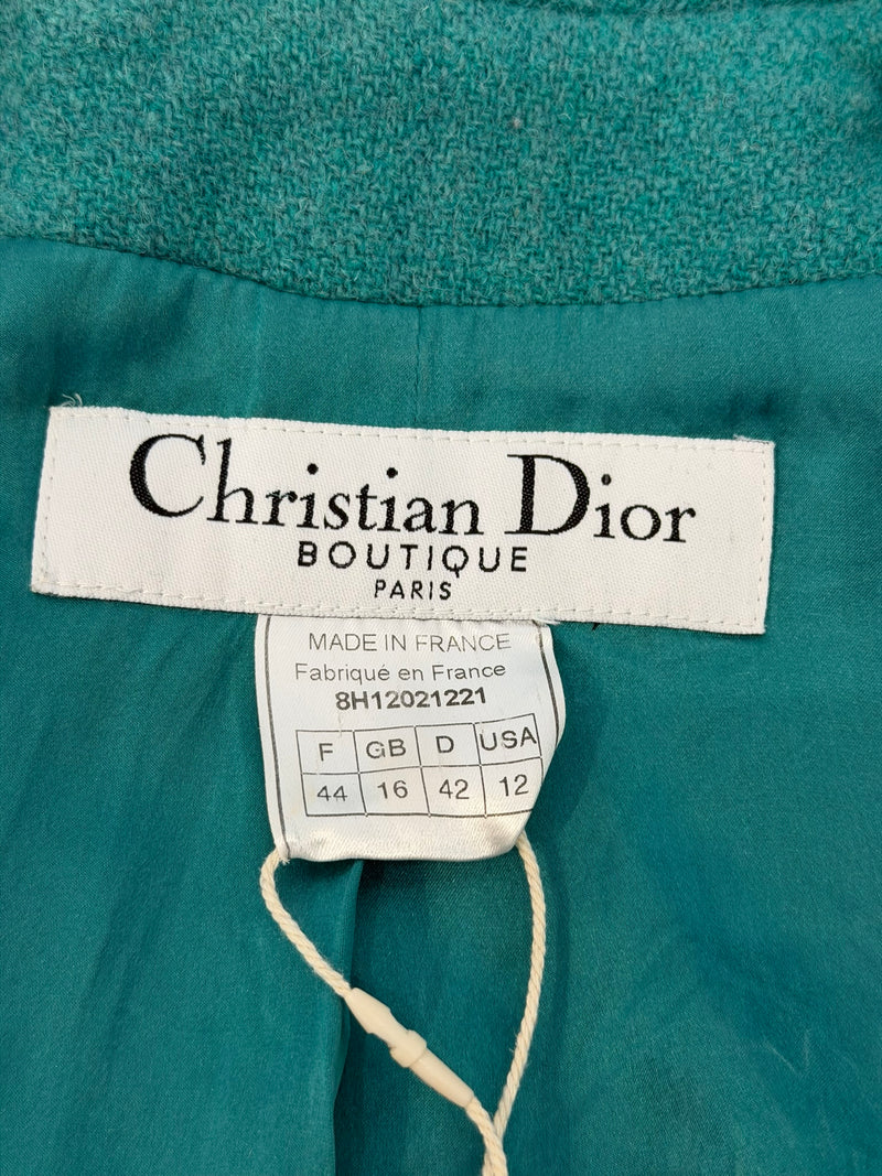 Close-up of fringe trim on collar and lapels of Dior tweed jacket