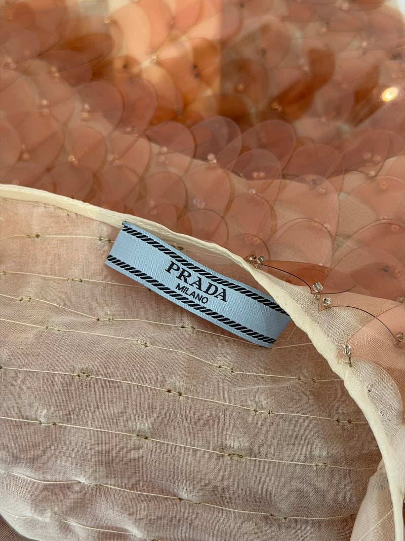 Detail of scoop neckline and short sleeve construction on Prada dress
