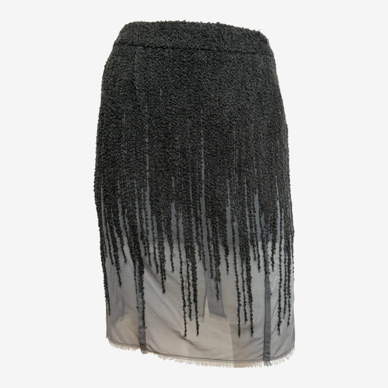 Black wool boucle skirt by Christian Dior, vertical fringe detail transitioning over gray silk chiffon