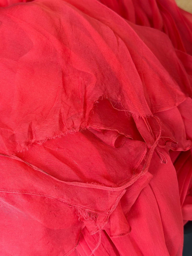 Red pleated chiffon gown by Alexander McQueen, hem and overall silhouette