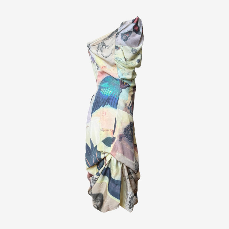 Side view of Vivienne Westwood draped dress with dramatic draped sleeve detail