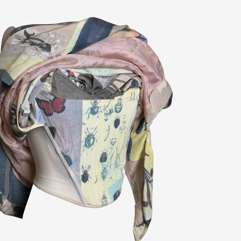 Close-up of scientific illustration print on Vivienne Westwood dress with handwritten text