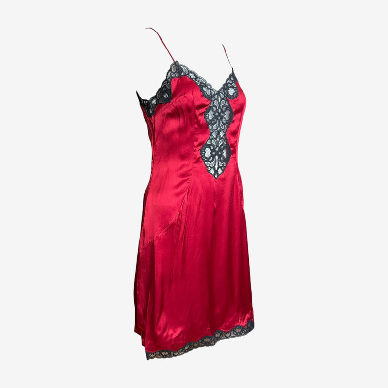 Red silk slip dress by Dolce & Gabbana, detail of black lace trim at sweetheart neckline