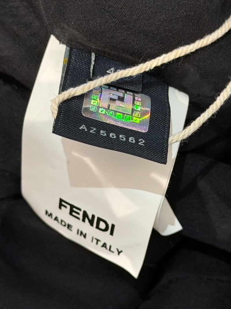 Charcoal black pleated silk mini dress by Fendi, close-up of knife pleating texture detail